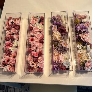 4 plastic rectgl “vases” with faux flowers. 2 Red & pink, 2 purple. 4”x 16” each